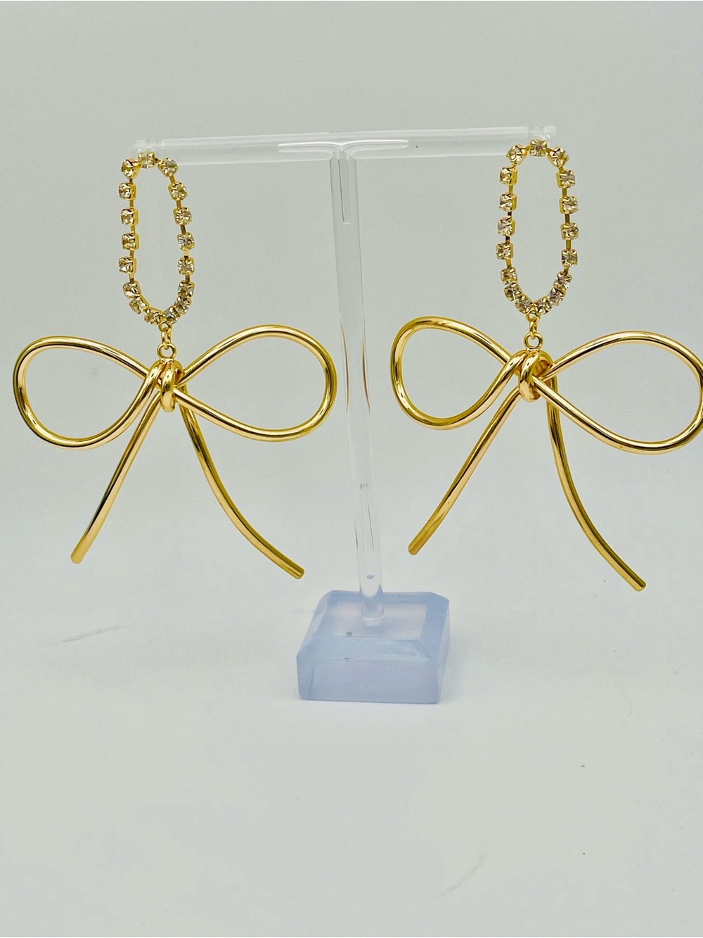 Gold Bow Dangle Earrings with Crystal Oval Loops. Pierced.